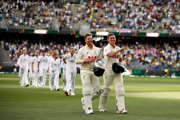 Steve Smith and Marnus Labuschagne leave the field  after wrapping up victory in the first Test within two days.