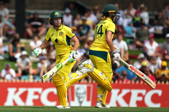 Alyssa Healy of Australia and Annabel Sutherland running between wickets