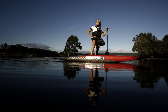 Australian slalom canoeist Jessica Fox poses in the flooded car park of the Penrith Whitewater Centre in March.