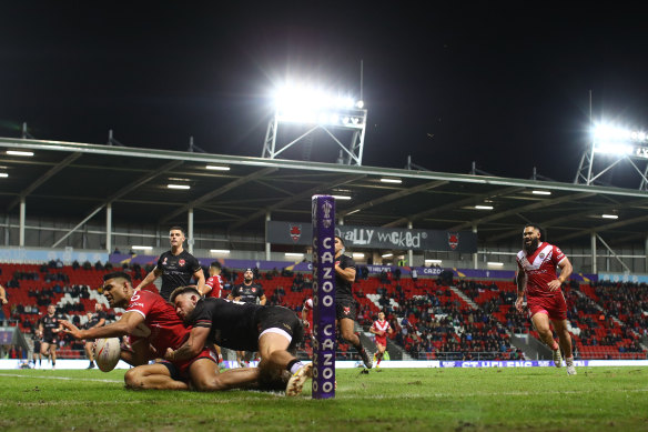 Daniel Tupou touches down for Tonga against Wales at St Helens.