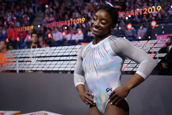 American Simone Biles has made history as the first woman to win five all-around gymnastics world titles.