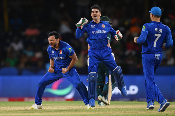 Afghanistan celebrate their victory over Australia.