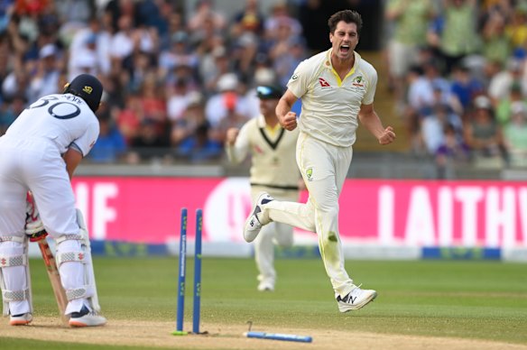 Pat Cummins celebrates the wicket of Ollie Pope.