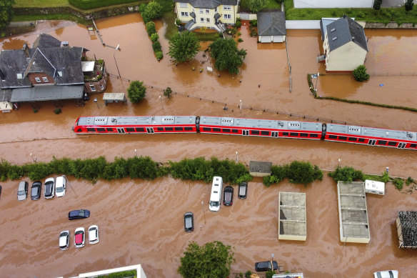 A train sits in floodwaters in Kordel, Germany.