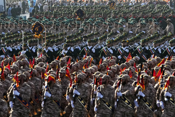 Iranian Revolutionary Guard members march during an annual armed forces parade this month.