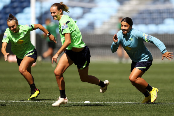 Caitlin Foord, Emily Van Egmond and Sam Kerr train at Allianz Stadium on Monday morning.