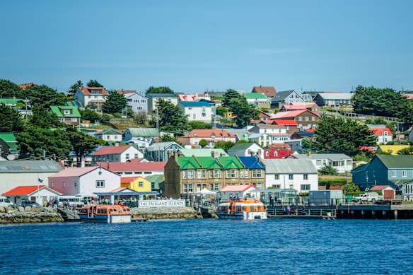 Colourful harbourside homes dominate the barren landscape.
