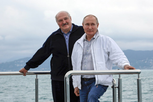Russian President Vladimir Putin, right, and Belarusian President Alexander Lukashenko pose for a photo standing on the boat during their meeting in the Black Sea resort of Sochi, in Russia, Saturday, May 29, 2021.