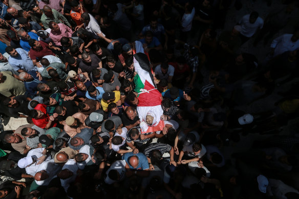 Mourners attend the funerals of Palestinians killed in recent Israeli air strikes on Sunday August 7, 2022 in Gaza City.