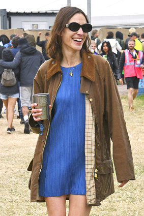 Alexa Chung  wearing her vintage Barbour jacket  in 2022 in Glastonbury, England.