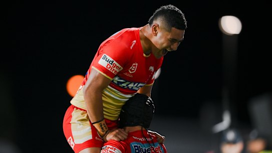 Isaiya Katoa and Kodi Nikorima celebrate for the Dolphins.