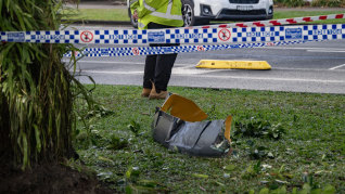 Debris from the helicopter crash on the Cairns Esplanade.