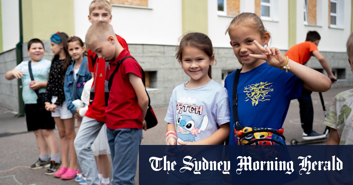 On the edge of danger, children laugh in quiet defiance of Putin and his missiles