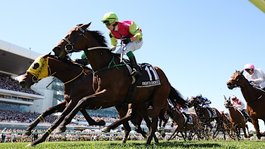 Robbie Dolan rides Knight’s Choice to narrowly win the Melbourne Cup from Warp Speed.