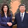 Chinese President Xi Jinping (right) shakes hands with Kuomintang (KMT) party leader Cheng Li-wun in Beijing on Friday.