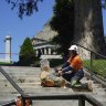 Emergency workers remove a branch that fell near the Shrine of Remembrance on Tuesday, injuring two people.