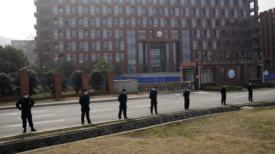 Security personnel guard the entrance to the Wuhan Institute of Virology.
