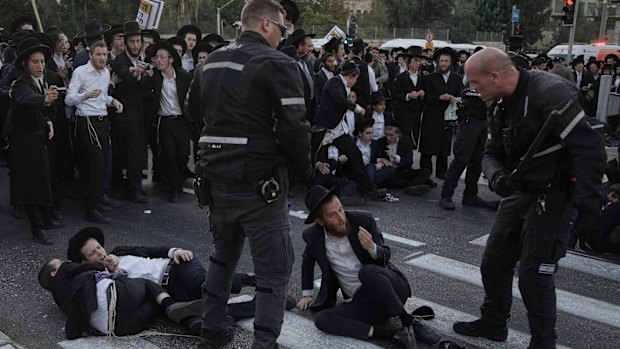 Police disperse ultra-Orthodox Jews blocking a road during a protest against army recruitment in Jerusalem this month.