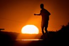 A man runs as the sun rises outside Frankfurt, Germany.