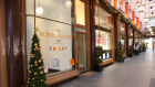 A pedestrian passes a shop available for letting at the Royal Arcade in Mayfair, London. 