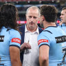 Blues coach Michael Maguire talks to Jarome Luai and Mitchell Moses at half-time of Origin II after rushing to the sideline.
