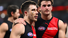 Zach Merrett of the Bombers looks dejected.