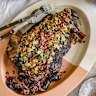 Serve the slow-roasted lamb shoulder with an almond and pomegranate crust.