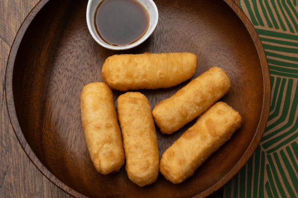 Tequenos (fried cheese pastries).