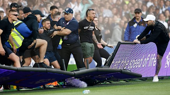 Fans storm the pitch during the match between Melbourne City and Melbourne Victory at AAMI Park.