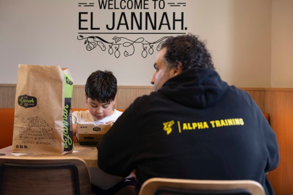 A family shares a meal at El Jannah in Randwick.