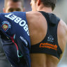 An athlete wears a Catapult heart monitor inside the  vest.