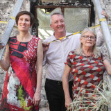 Creative Industries Minister Martin Foley with La Mama's co-chief executive's Caitlin Dullard (left) and Liz Jones inside the burnt theatre.