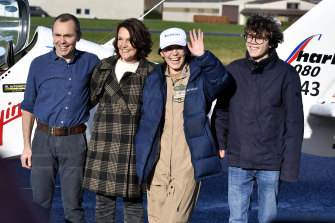 Belgium-British teenage pilot Zara Rutherford, centre, poses with her family after landing her Shark ultralight plane in Kortrijk, in the greater Flanders region of Belgium.