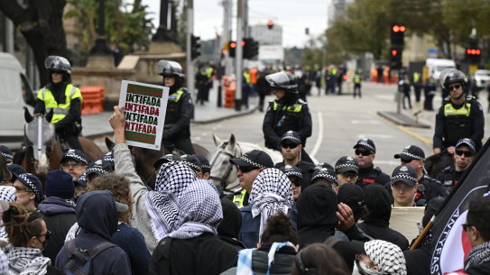 Pro-Palestine protesters were held back by police to stop them approaching a pro-Israel protest.