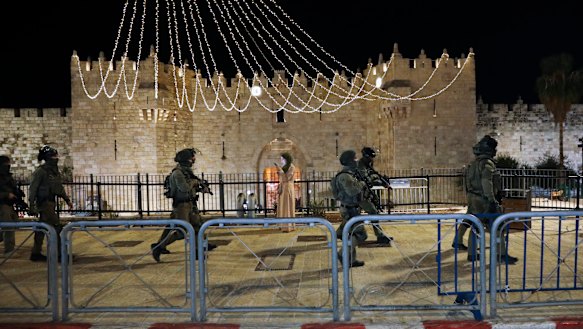 Israeli police officers deploy during clashes with Palestinian protesters next to Damascus Gate in Jerusalem’s Old City on Friday.