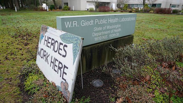 A sign acknowledging staff is displayed outside the Washington State Department of Health’s Public Health Laboratory in Shoreline. The lab sequences COVID-19 variants.