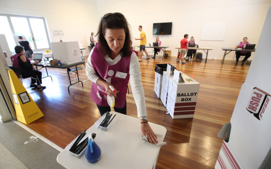 A polling booth official at work during the COVID-19 pandemic in Brisbane.