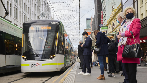 People wearing face masks in Melbourne in July.