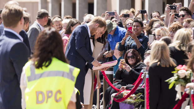 The Duke and Duchess of Sussex meet the crowd outside the Sydney Opera House on Tuesday.