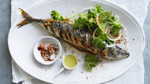 Grilled whole mackerel with ginger masala and onion salad.