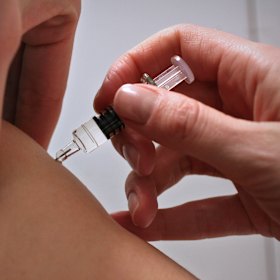 Parents are urged to vaccinate children against flu as cases spike.