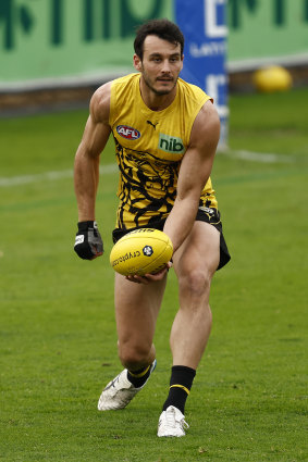 Robbie Tarrant protects his hand at training on Wednesday.