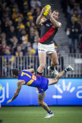 Hang time: Tom Bellchambers gets up over Chris Masten of the Eagles.