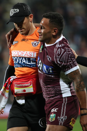 Cruel blow: Apisai Koroisau leaves the field after breaking his foot against the Warriors.