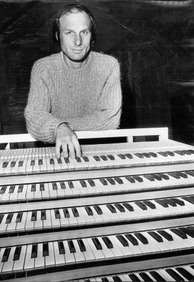 Mr. Ron Sharp, who is making an organ for the Opera House, photographed  at the key board at his Mortdale factory, 1973.