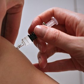 Parents are urged to vaccinate children against flu as cases spike.