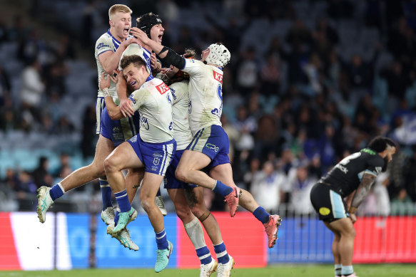 Bulldogs players mob Matt Burton after his match-winning field goal last month.