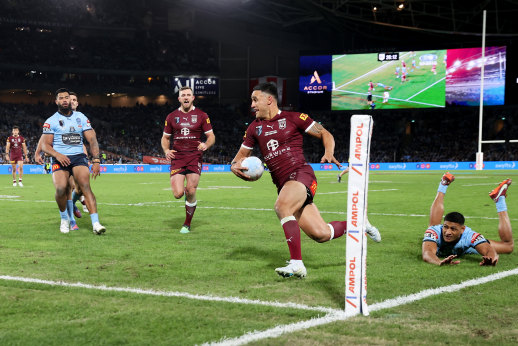 Valentine Holmes beats Daniel Tupou’s despairing dive to score the Maroons’ decisive try.