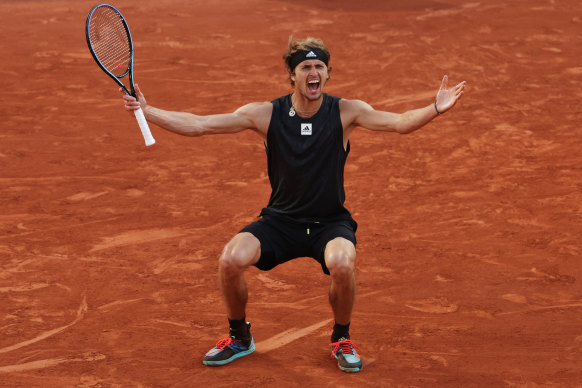 An ecstatic Alexander Zverev celebrates his victory over Carlos Alcaraz.