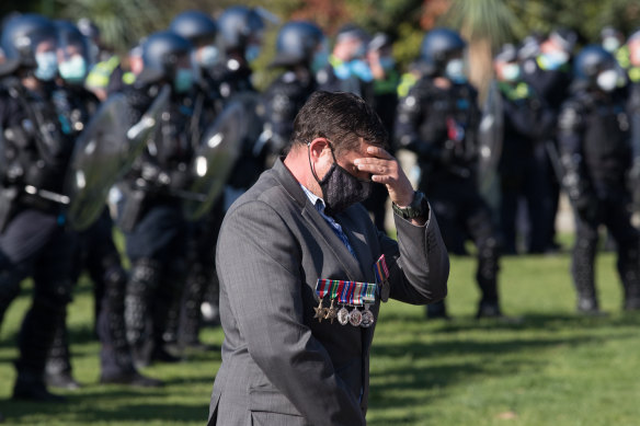 A visibly upset man at the Shrine on Wednesday. Victoria Police Deputy Commissioner Ross Guenther said it was “completely disrespectful” the protesters gathered there. 